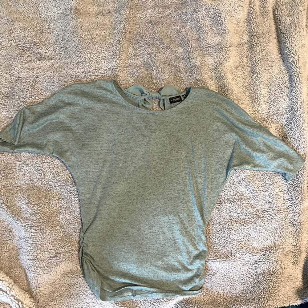 Green sweater with bow on back neck